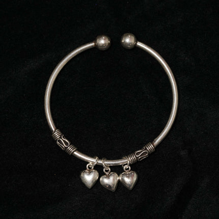 "Silver Oxidized Kada with Heart Charms – Timeless Elegance with a Rustic Touch"