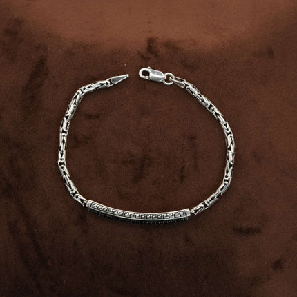 Define your style with the rugged allure of this men's bracelet in black stone