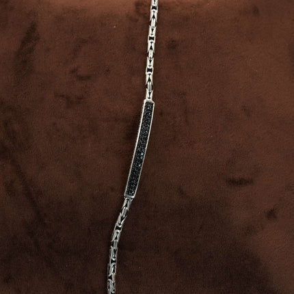 Define your style with the rugged allure of this men's bracelet in black stone
