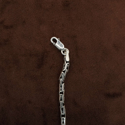 Define your style with the rugged allure of this men's bracelet in black stone