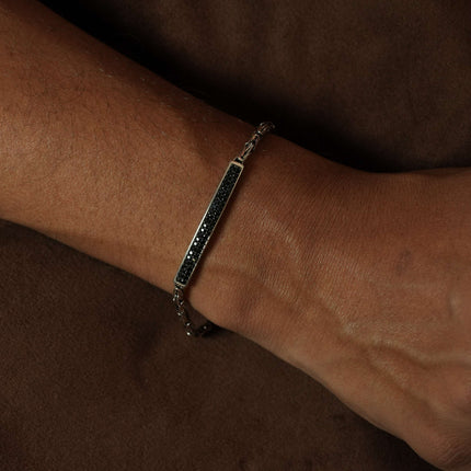 Define your style with the rugged allure of this men's bracelet in black stone