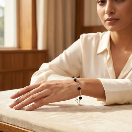 Silver Bracelet with Black Charms – Simple and Stylish