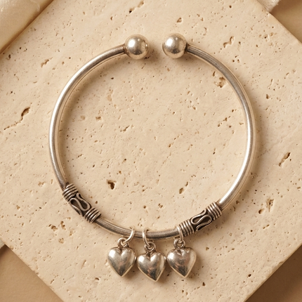 "Silver Oxidized Kada with Heart Charms – Timeless Elegance with a Rustic Touch"