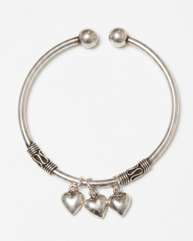 "Silver Oxidized Kada with Heart Charms – Timeless Elegance with a Rustic Touch"